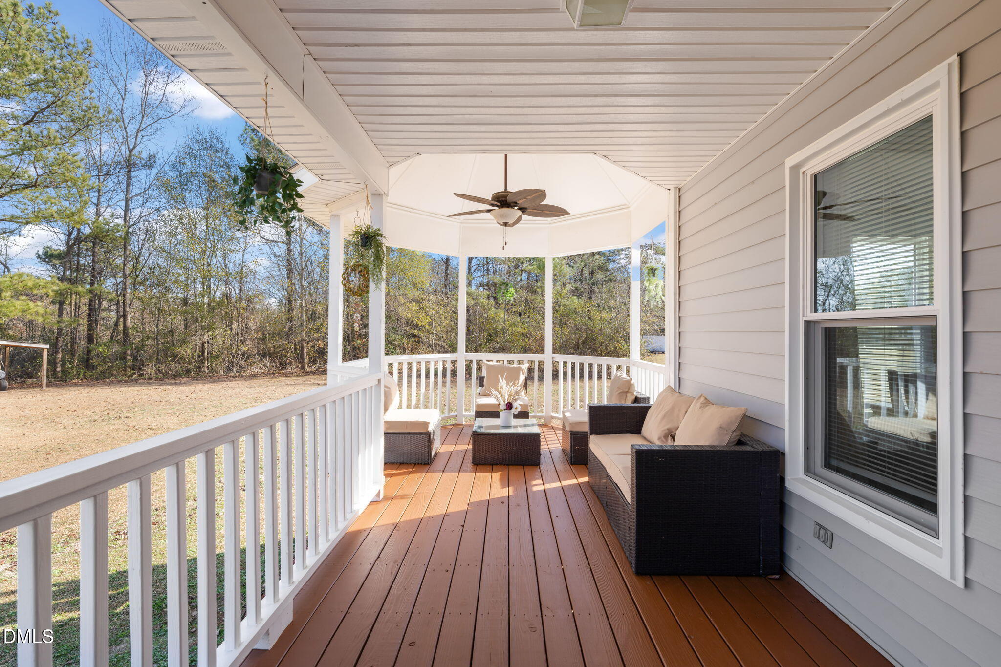 3649 Cleveland Road Smithfield, NC 27577 - Photo 3 of 37 a balcony with wooden floor and furniture