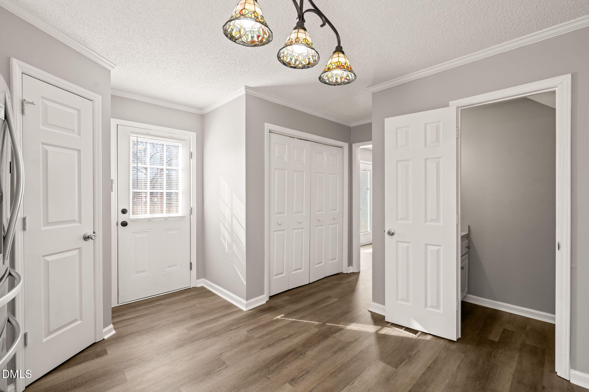 3649 Cleveland Road Smithfield, NC 27577 - Photo 8 of 37 an empty room with wooden floor and windows