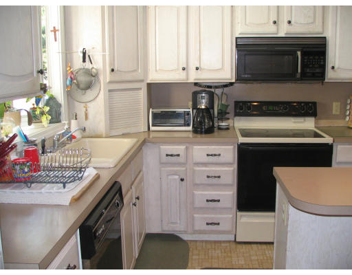 125 Franklin Road Longmeadow, MA 01106 - Photo 4 of 10 a kitchen with stainless steel appliances granite countertop a stove and a microwave