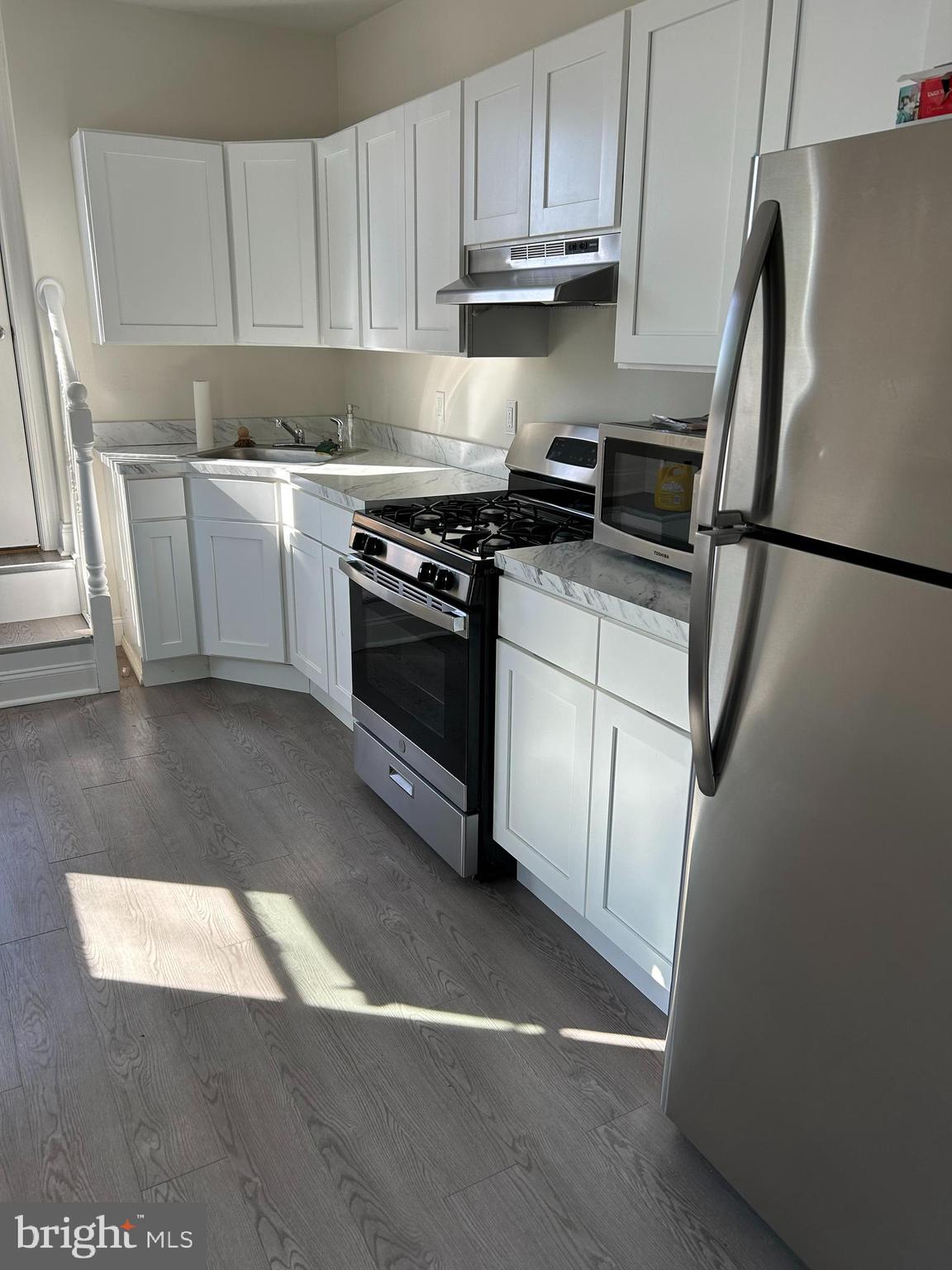 52 South Fellowship Road Maple Shade, NJ 08052 - Photo 3 of 10 a kitchen with stainless steel appliances a refrigerator stove and sink