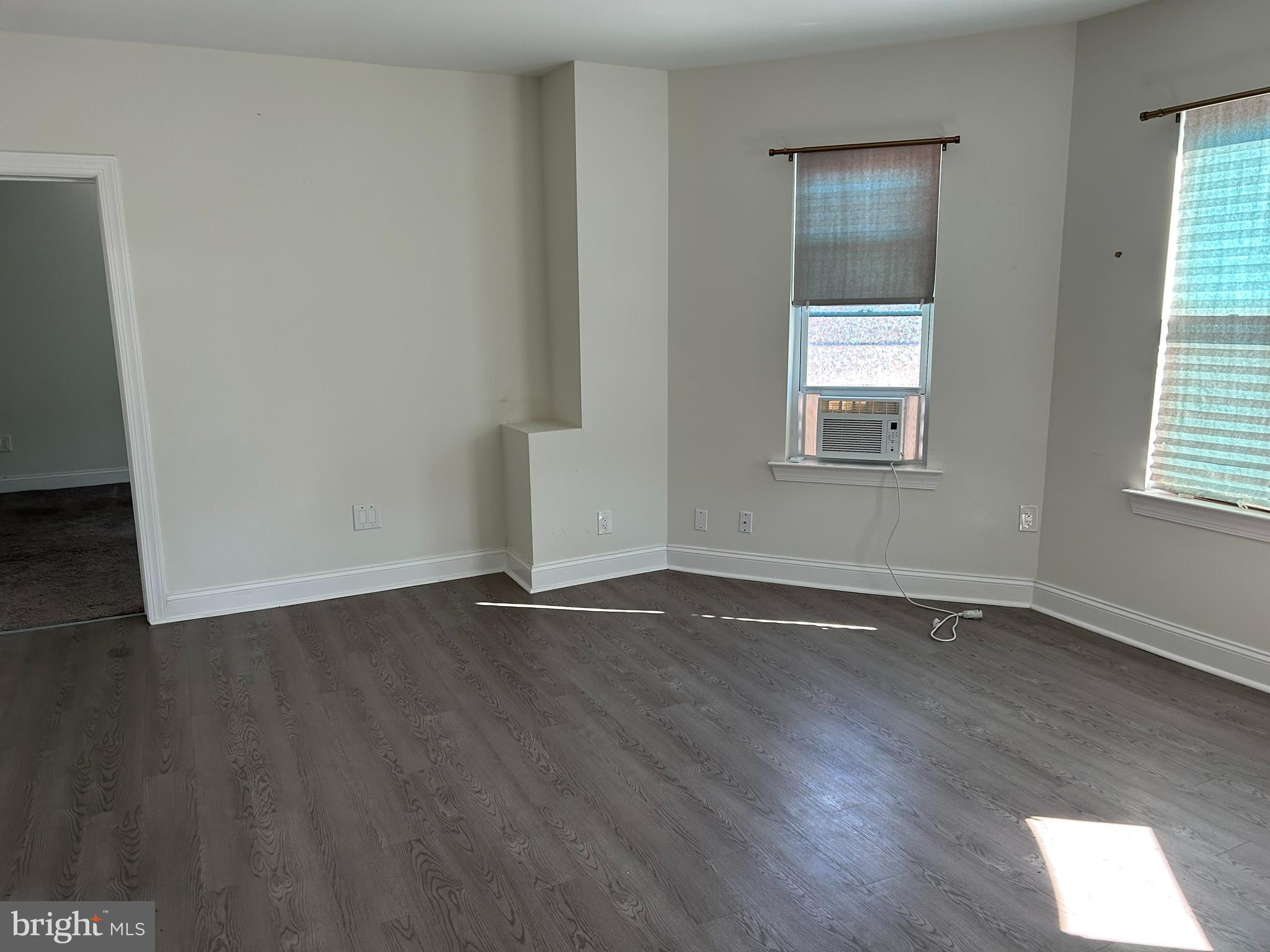 52 South Fellowship Road Maple Shade, NJ 08052 - Photo 8 of 10 an empty room with wooden floor and windows