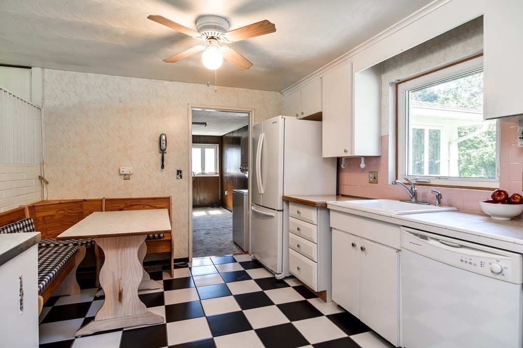 22 Francine Road Framingham, MA 01701 - Photo 13 of 30 a room with a sink a refrigerator and cabinets