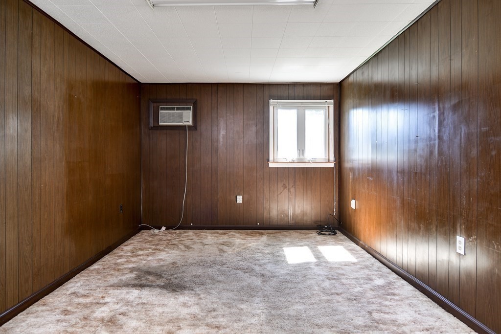 22 Francine Road Framingham, MA 01701 - Photo 17 of 30 a view of an empty room with wooden floor and windows