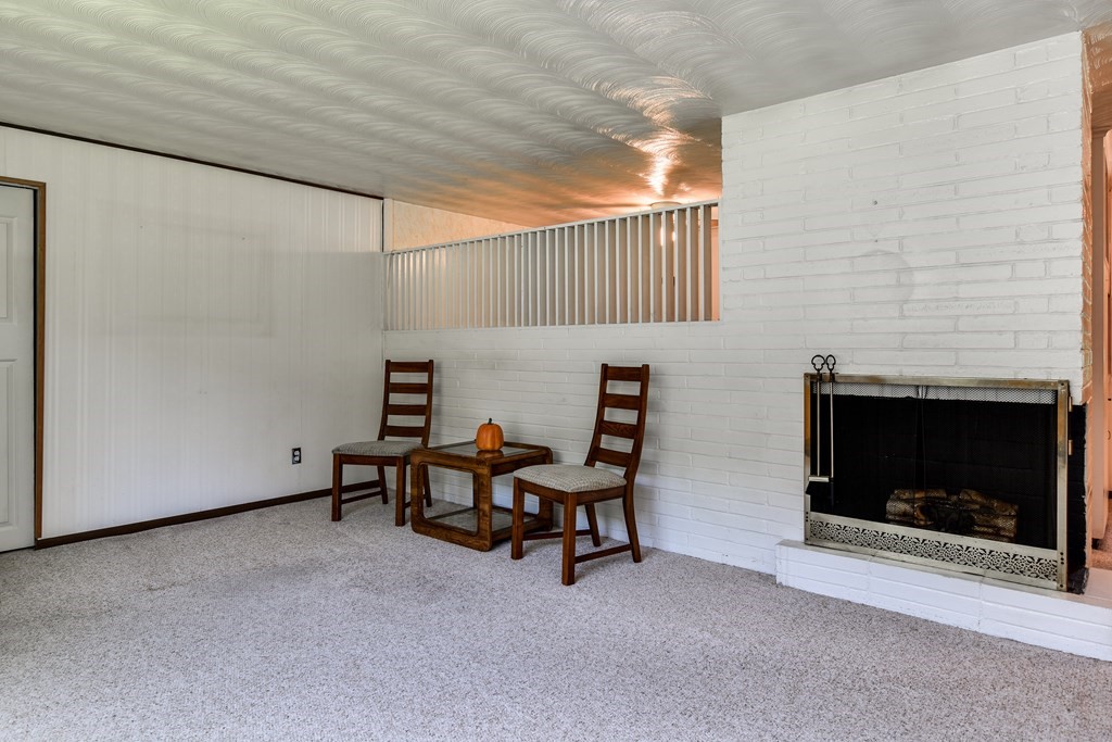 22 Francine Road Framingham, MA 01701 - Photo 4 of 30 a view of a livingroom with furniture and a fireplace