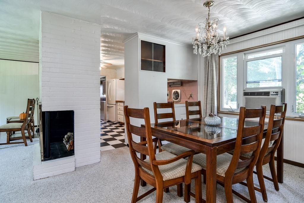 22 Francine Road Framingham, MA 01701 - Photo 6 of 30 a view of a dining room with furniture and a chandelier