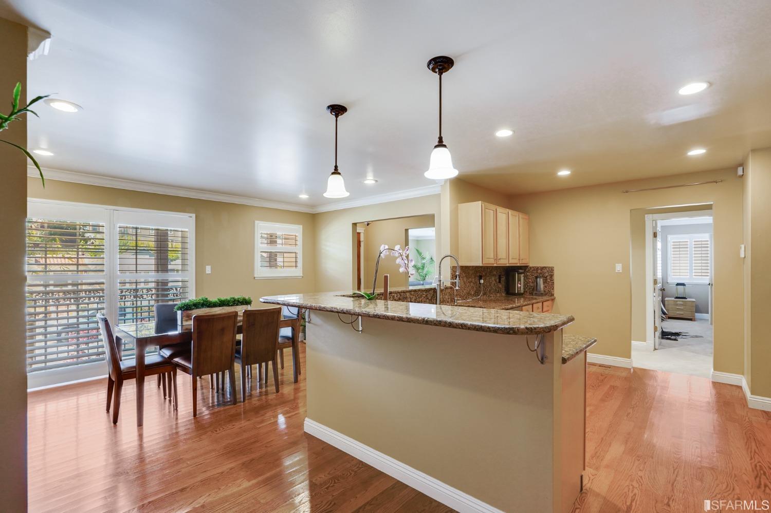 474 Oak Avenue San Bruno, CA 94066 - Photo 14 of 51 a kitchen with stainless steel appliances granite countertop table chairs stove and wooden floor