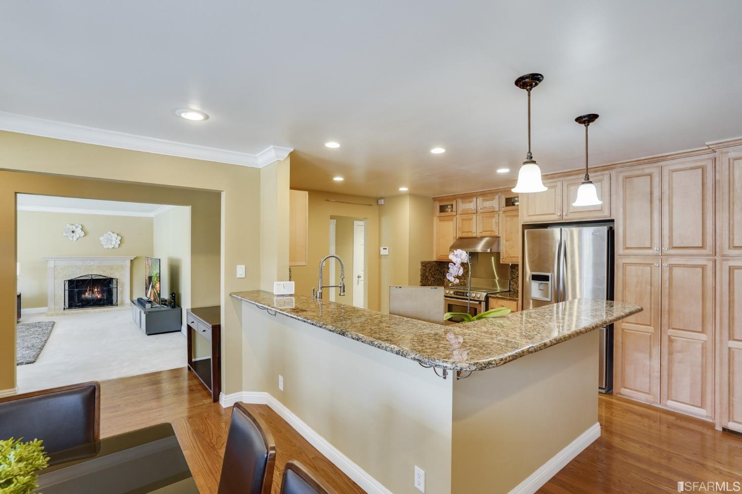 474 Oak Avenue San Bruno, CA 94066 - Photo 19 of 51 a kitchen with kitchen island granite countertop counter top space cabinets and stainless steel appliances