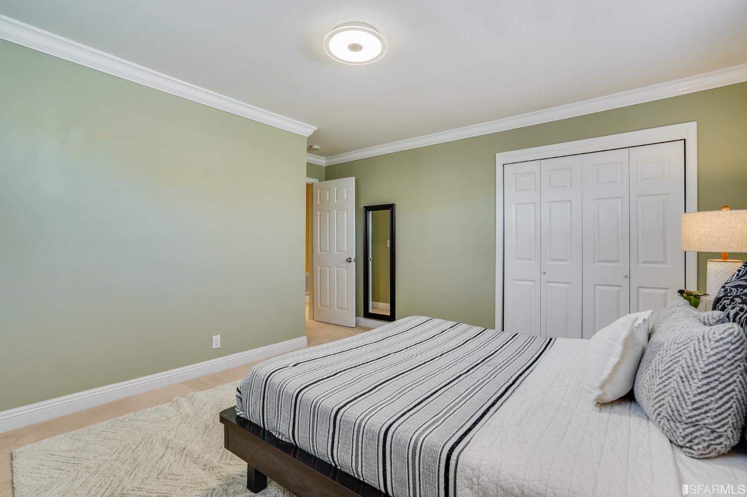 474 Oak Avenue San Bruno, CA 94066 - Photo 21 of 51 a bedroom with a bed and a lamp
