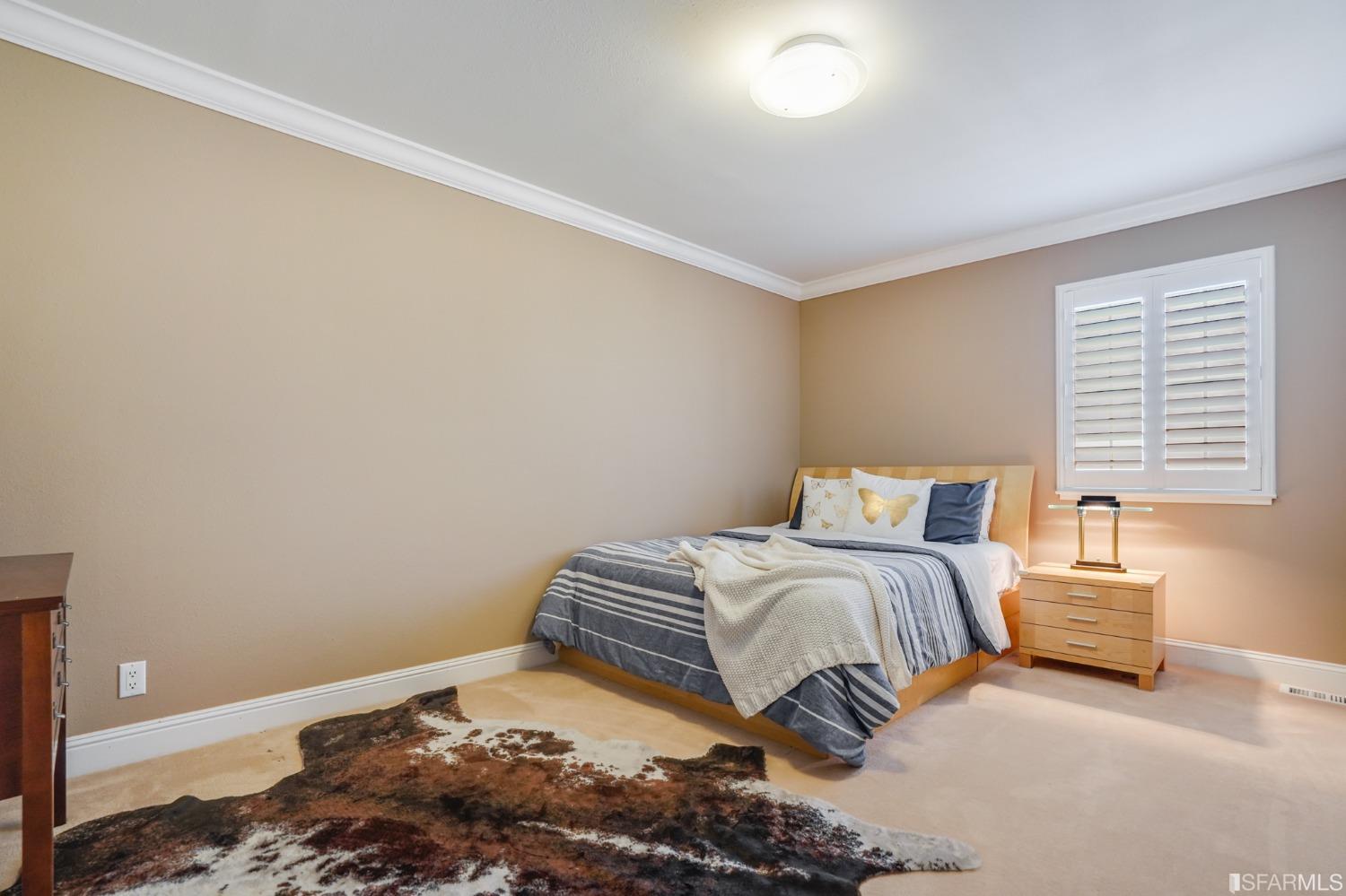 474 Oak Avenue San Bruno, CA 94066 - Photo 23 of 51 a bedroom with a bed and a window