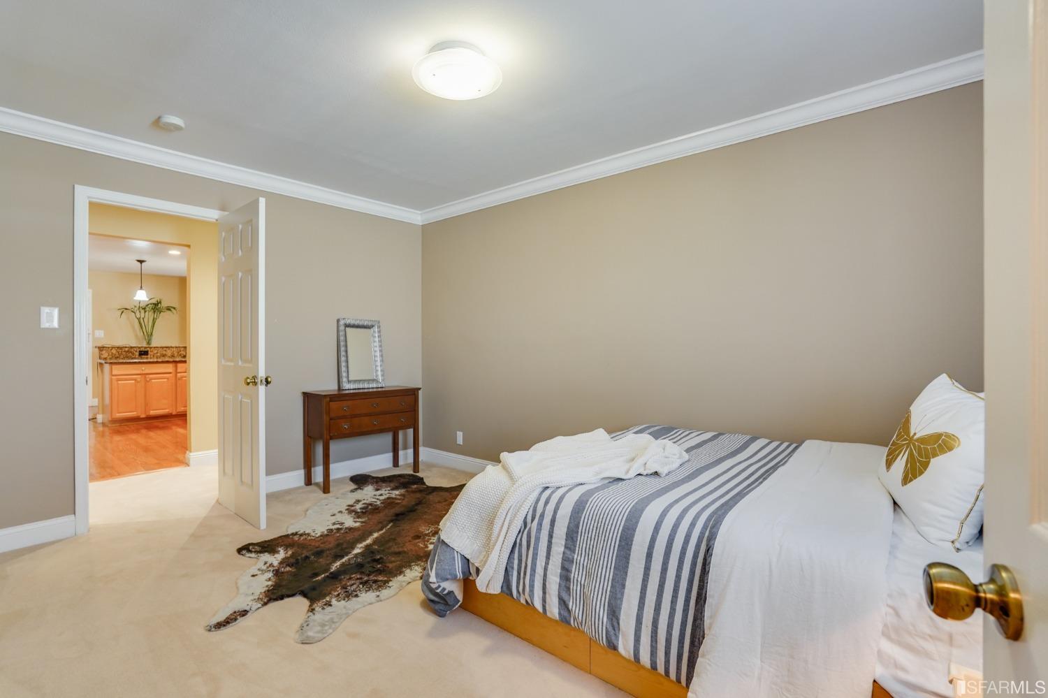 474 Oak Avenue San Bruno, CA 94066 - Photo 24 of 51 a bedroom with a bed and a table in it