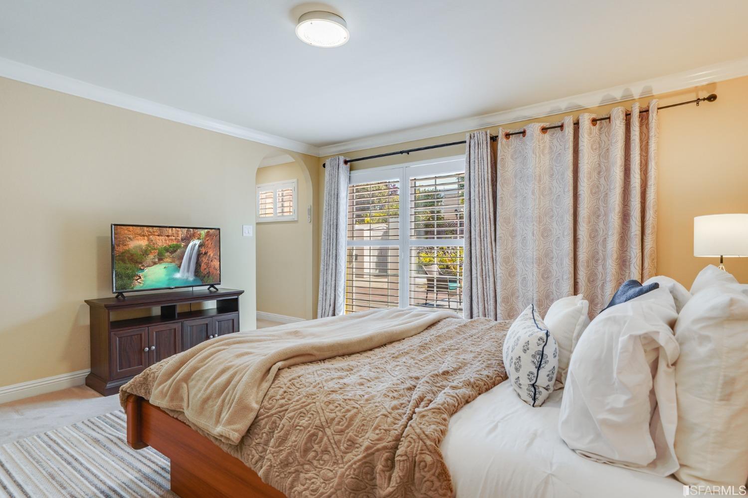 474 Oak Avenue San Bruno, CA 94066 - Photo 26 of 51 a bedroom with a bed and a flat screen tv