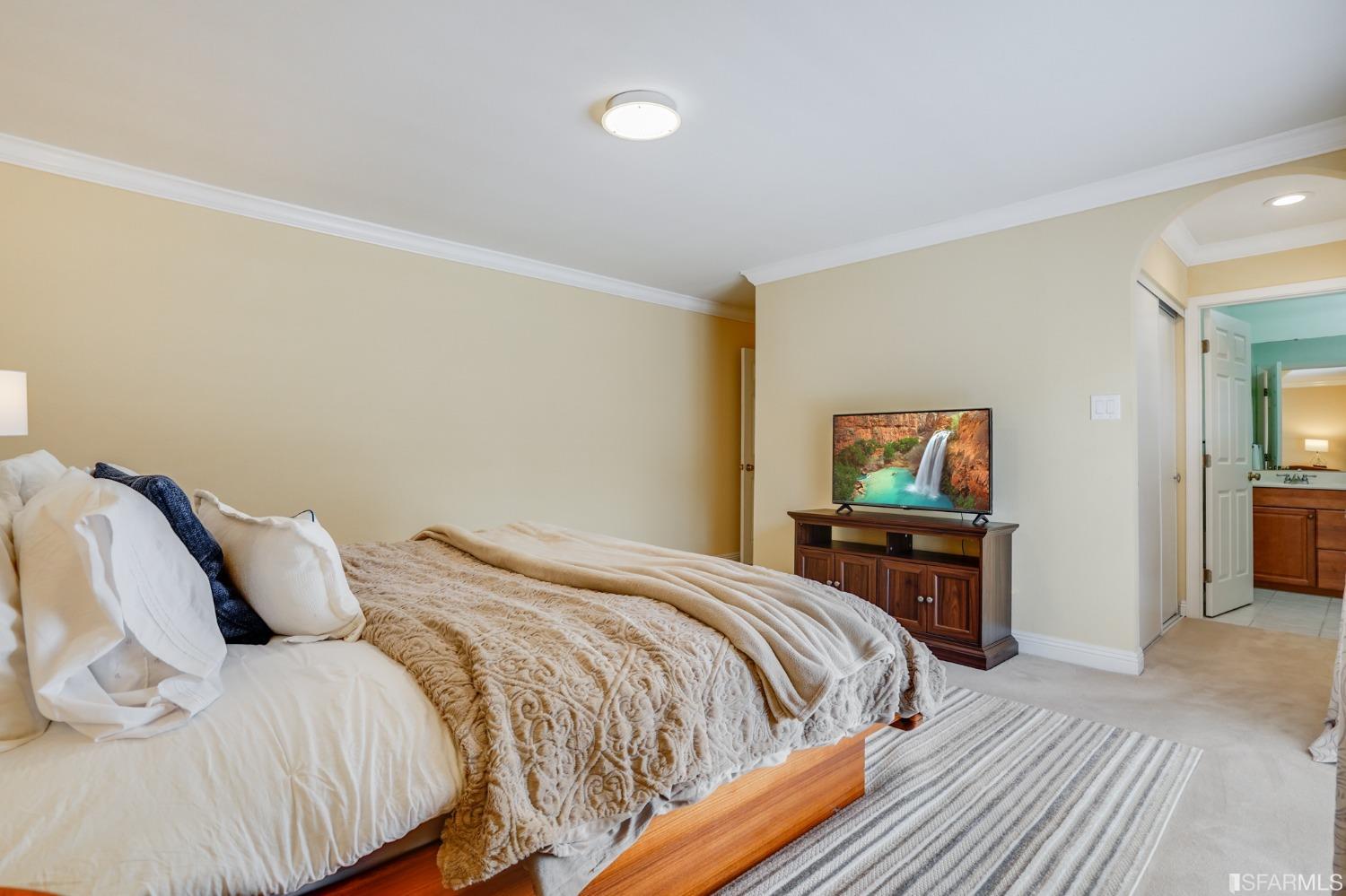 474 Oak Avenue San Bruno, CA 94066 - Photo 38 of 51 a bedroom with a bed and wooden floor