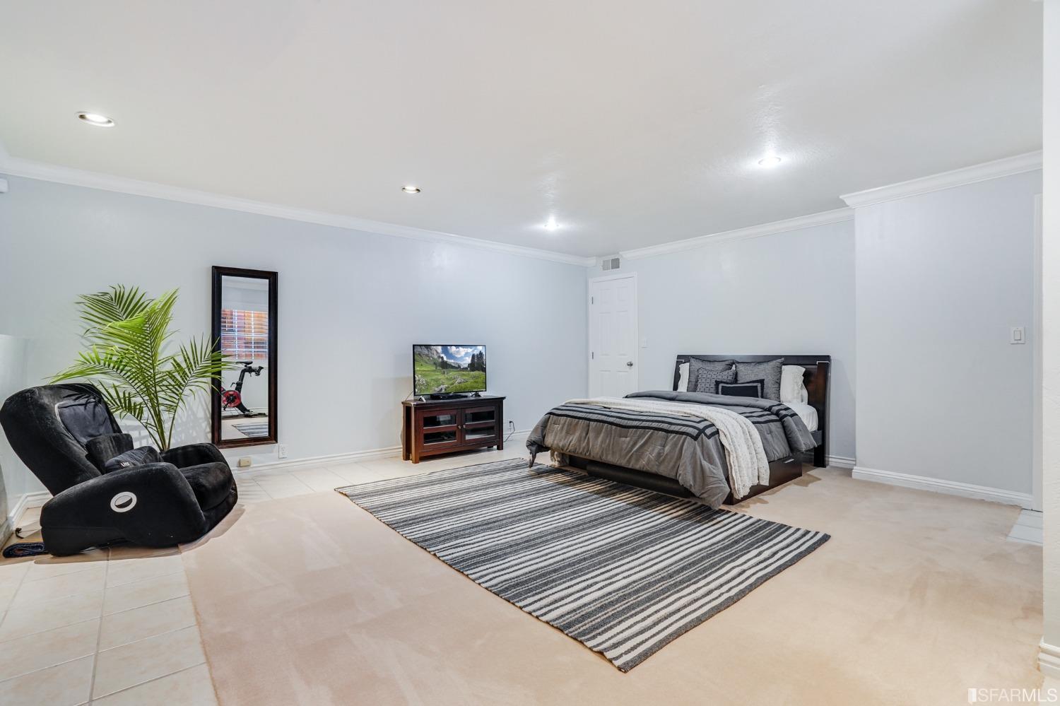 474 Oak Avenue San Bruno, CA 94066 - Photo 43 of 51 a bedroom with a bed and couch