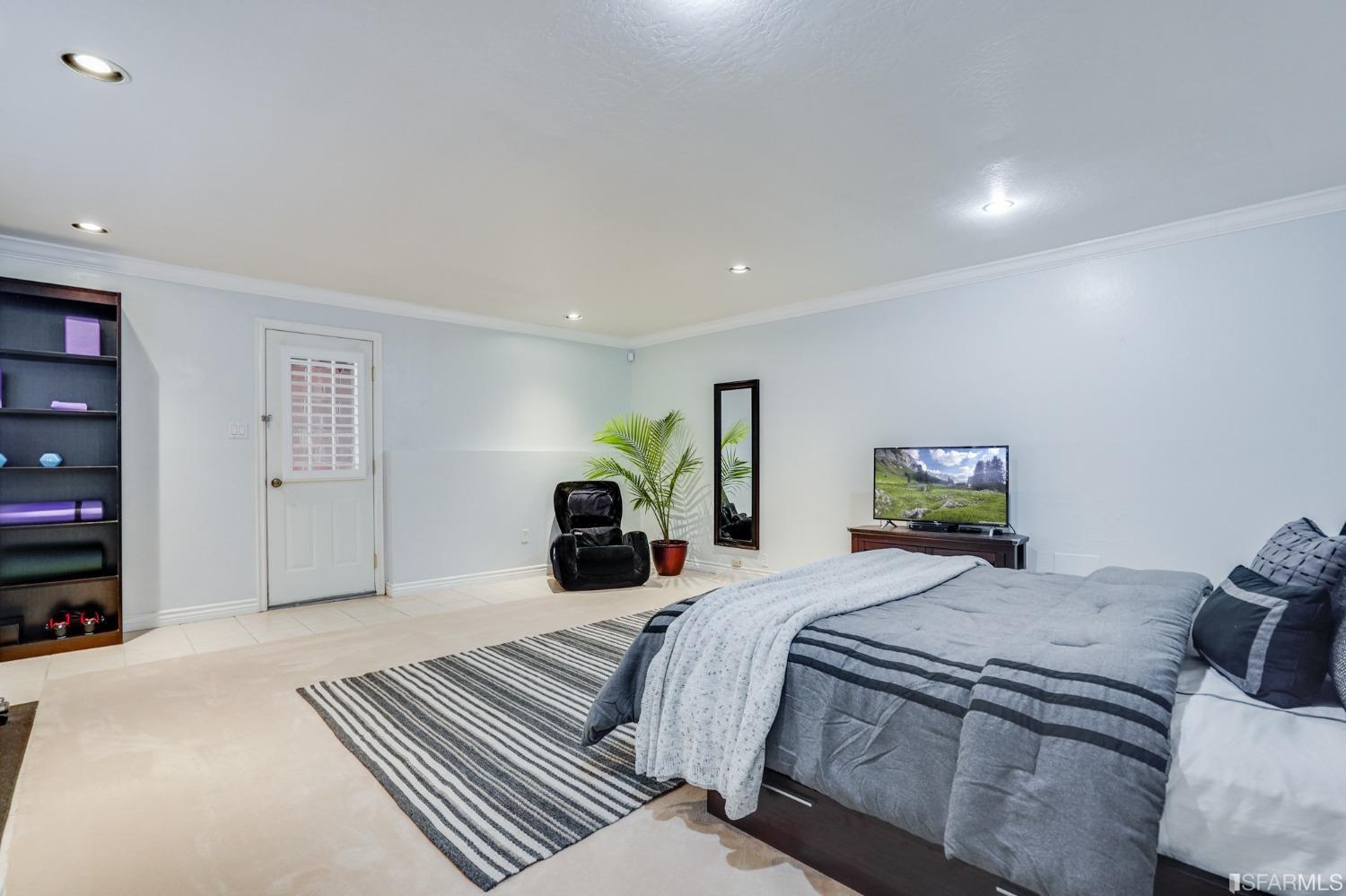 474 Oak Avenue San Bruno, CA 94066 - Photo 44 of 51 a bedroom with double bed and a couch