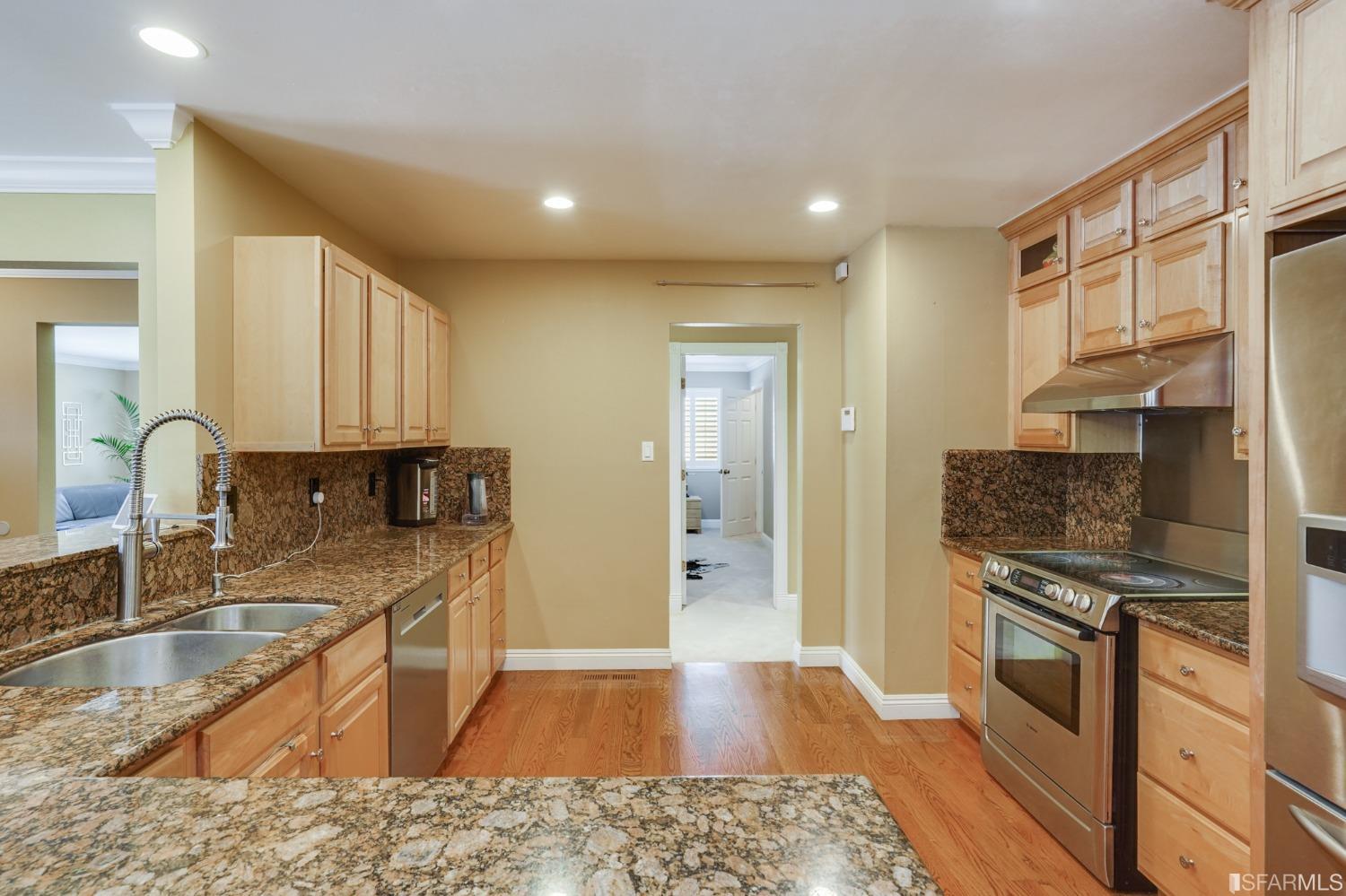 474 Oak Avenue San Bruno, CA 94066 - Photo 10 of 51 a kitchen with stainless steel appliances granite countertop a sink stove and refrigerator