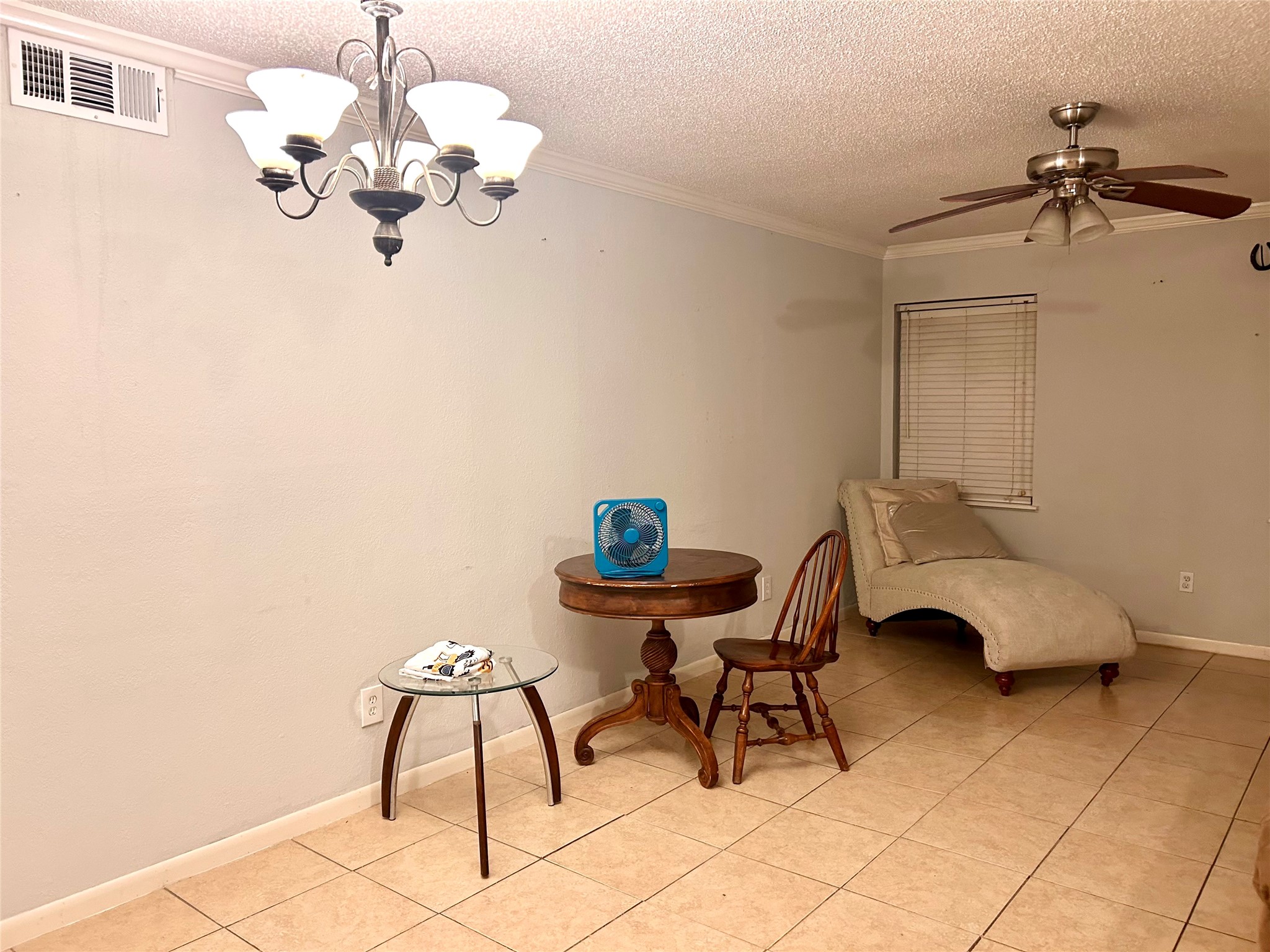 11643 Chimney Rock Road, Unit B Houston, TX 77035 - Photo 5 of 9 a view of a dining room with furniture and chandelier