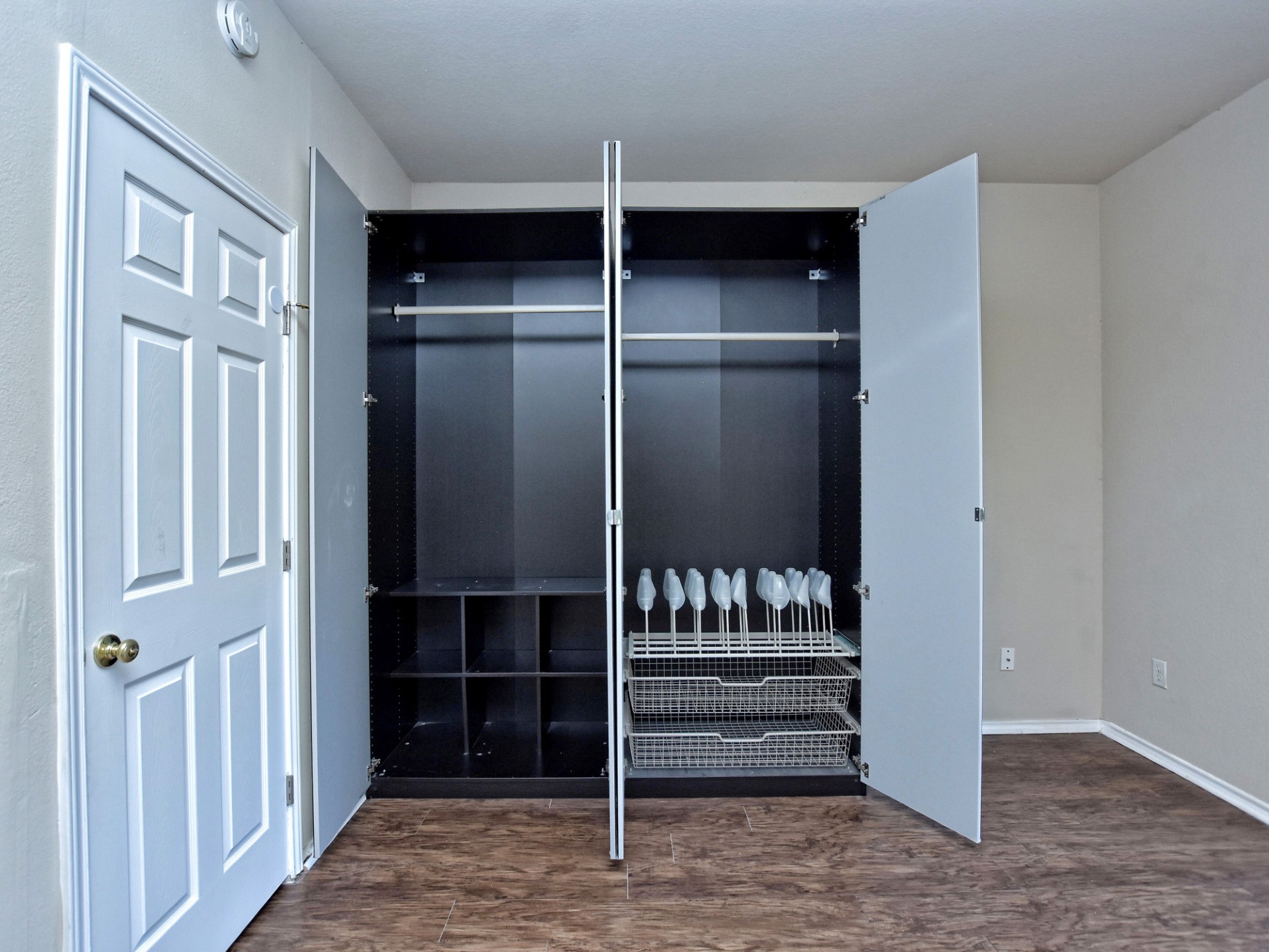 917 East 3rd Street Georgetown, TX 78626 - Photo 17 of 23 A clever, integrated wardrobe with shelving provides efficient storage in this bedroom.