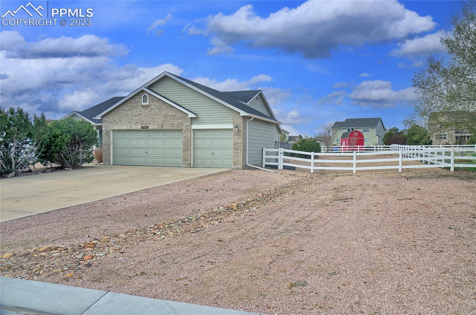 7724 McLaughlin Road Peyton, CO 80831 - Photo 6 of 23 3-car garage and wide side yard