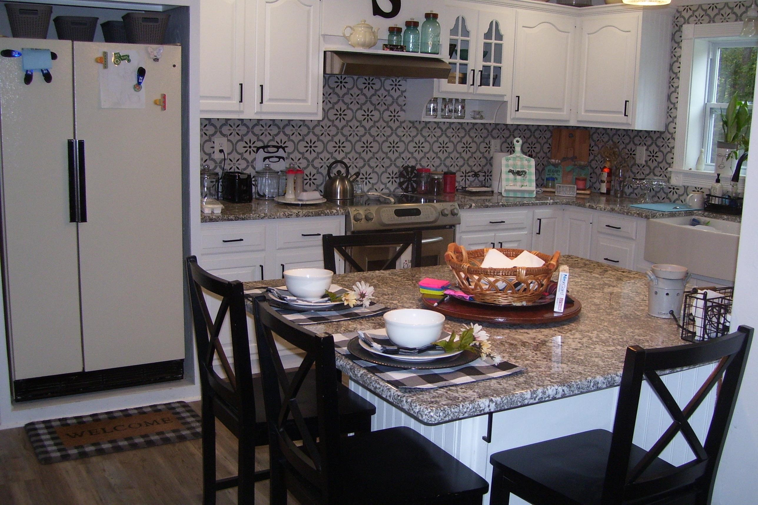 743 Comertown Road Shenandoah, VA 22849 - Photo 23 of 28 a kitchen with a table and chairs in it