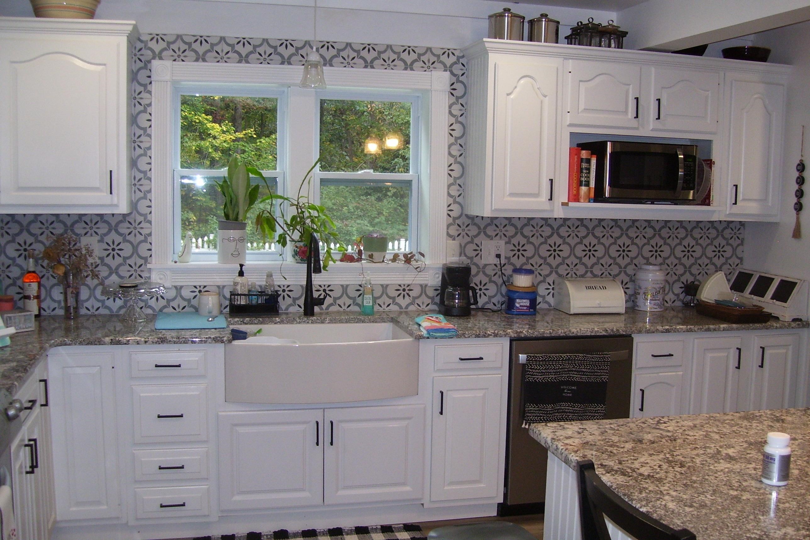 743 Comertown Road Shenandoah, VA 22849 - Photo 24 of 28 a kitchen with granite countertop a sink stove and cabinets