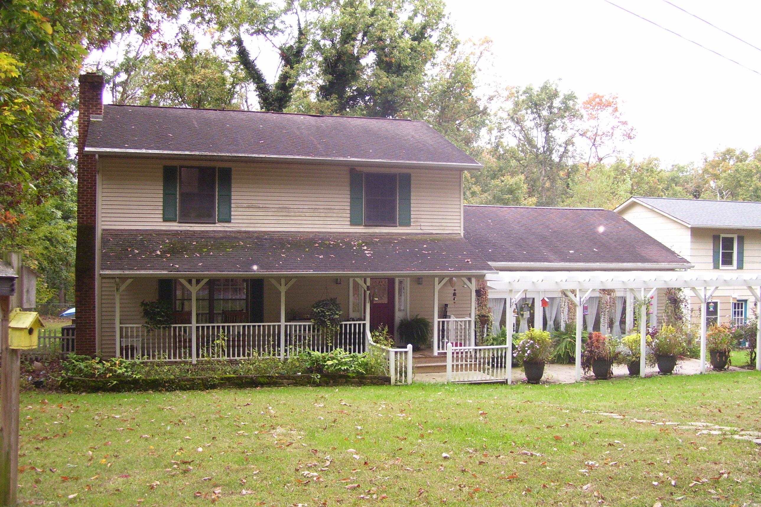 743 Comertown Road Shenandoah, VA 22849 - Photo 3 of 28 a view of a house with a garden and swimming pool