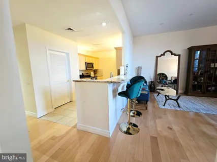 a white refrigerator freezer sitting inside of a kitchen