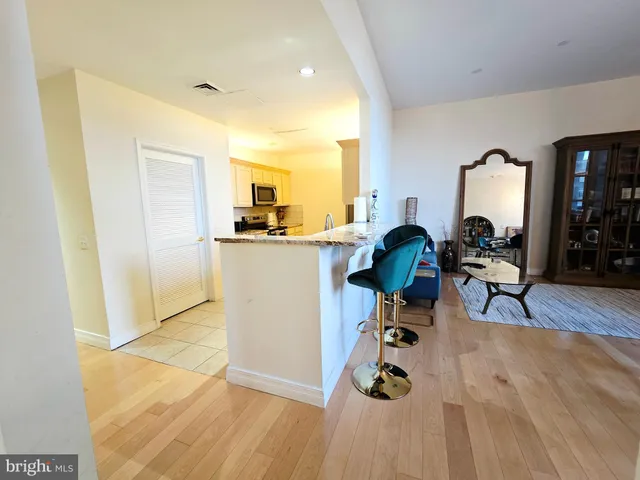 a white refrigerator freezer sitting inside of a kitchen