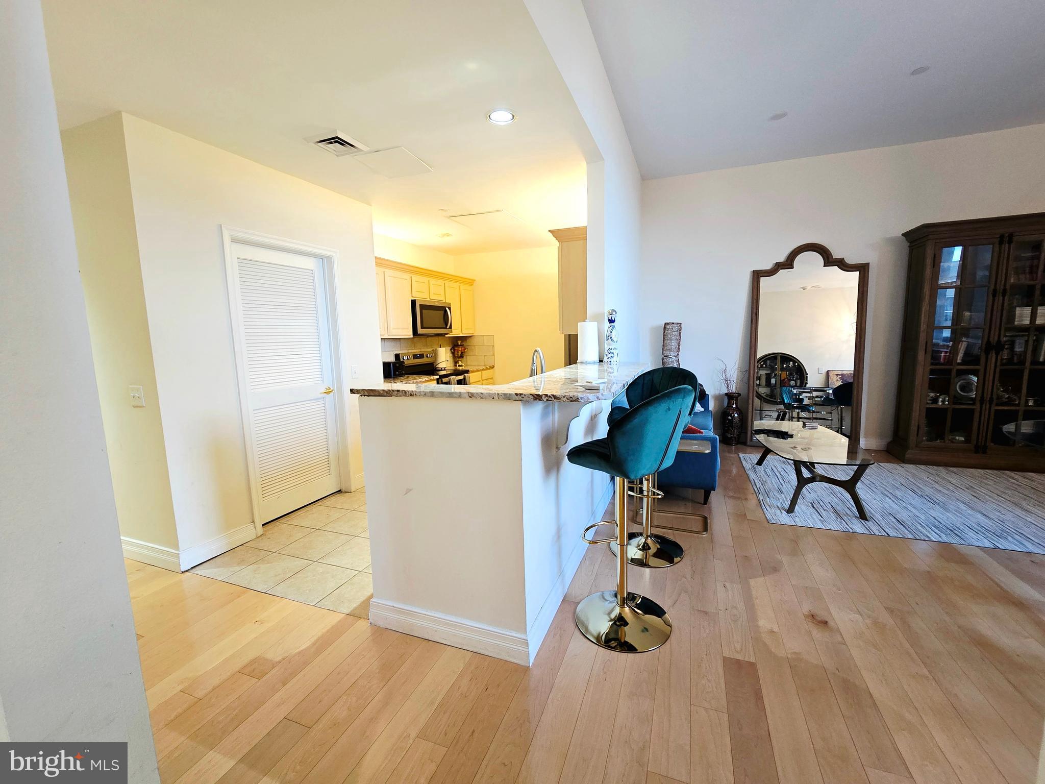 1600 Arch Street, Unit 1905 Philadelphia, PA 19103 - Photo 23 of 92 a living room with furniture and a chandelier