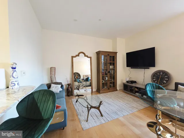 a kitchen with granite countertop sink and cabinets