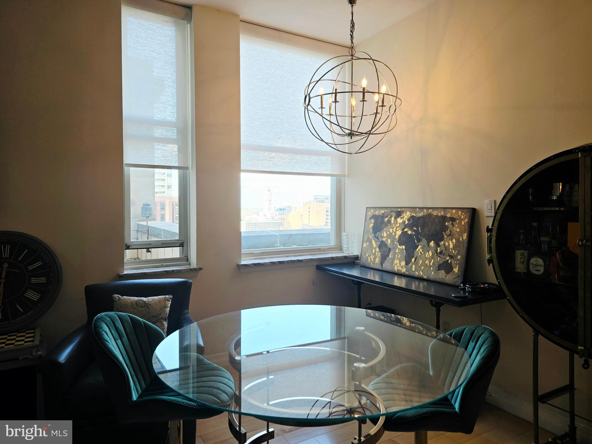 1600 Arch Street, Unit 1905 Philadelphia, PA 19103 - Photo 28 of 92 a view of a dining room with furniture window and wooden floor