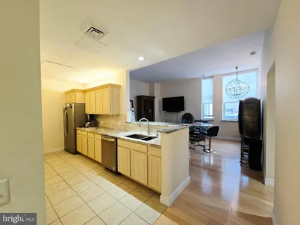 a living room with furniture and a rug
