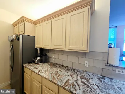 a living room with lots of furniture and a book shelf