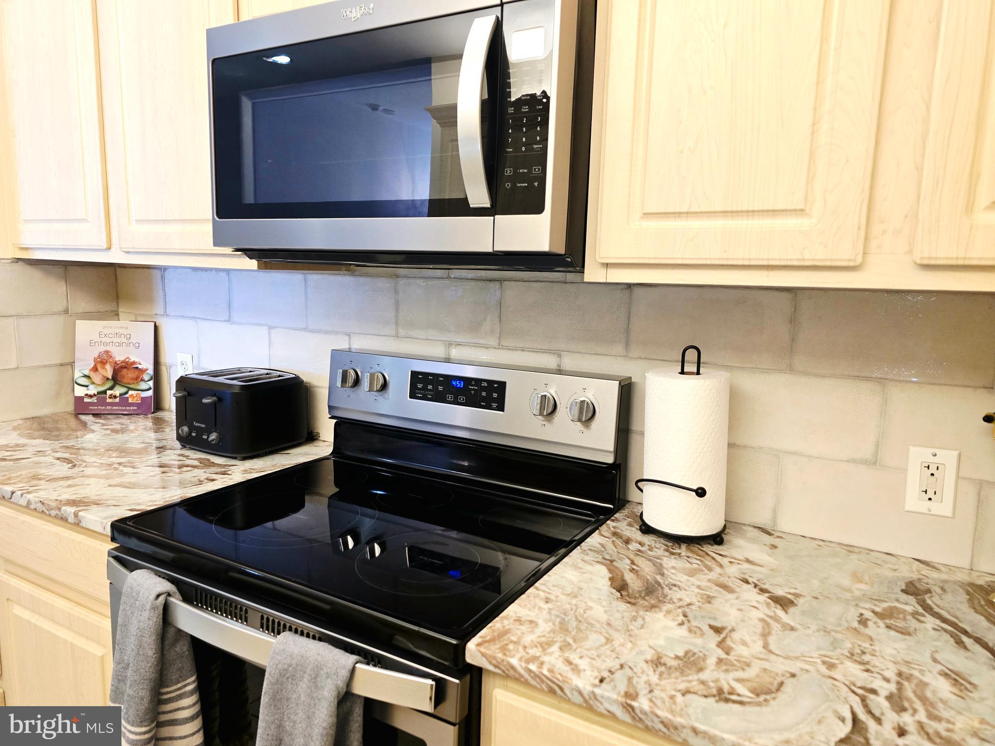 1600 Arch Street, Unit 1905 Philadelphia, PA 19103 - Photo 40 of 92 a kitchen with a stove and a microwave