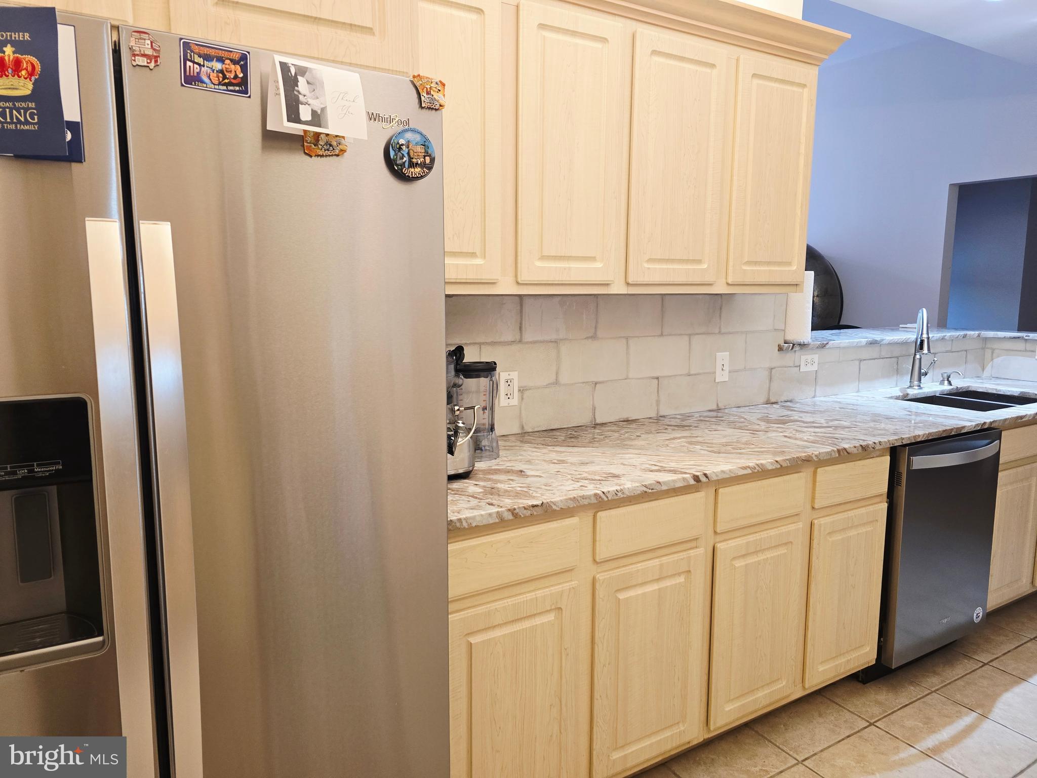 1600 Arch Street, Unit 1905 Philadelphia, PA 19103 - Photo 43 of 92 a kitchen with stainless steel appliances granite countertop a refrigerator and a sink