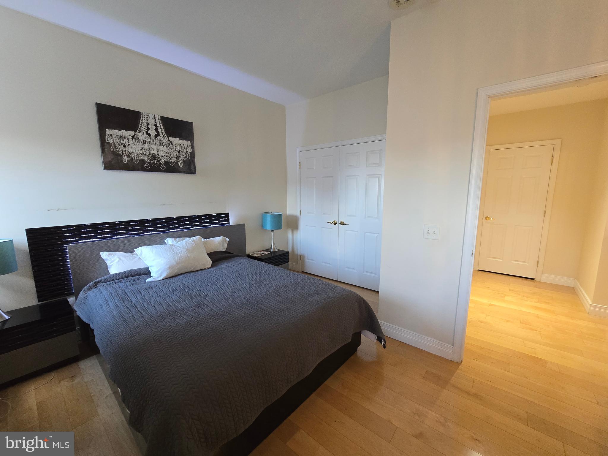 1600 Arch Street, Unit 1905 Philadelphia, PA 19103 - Photo 49 of 92 a bedroom with a bed dresser and a window