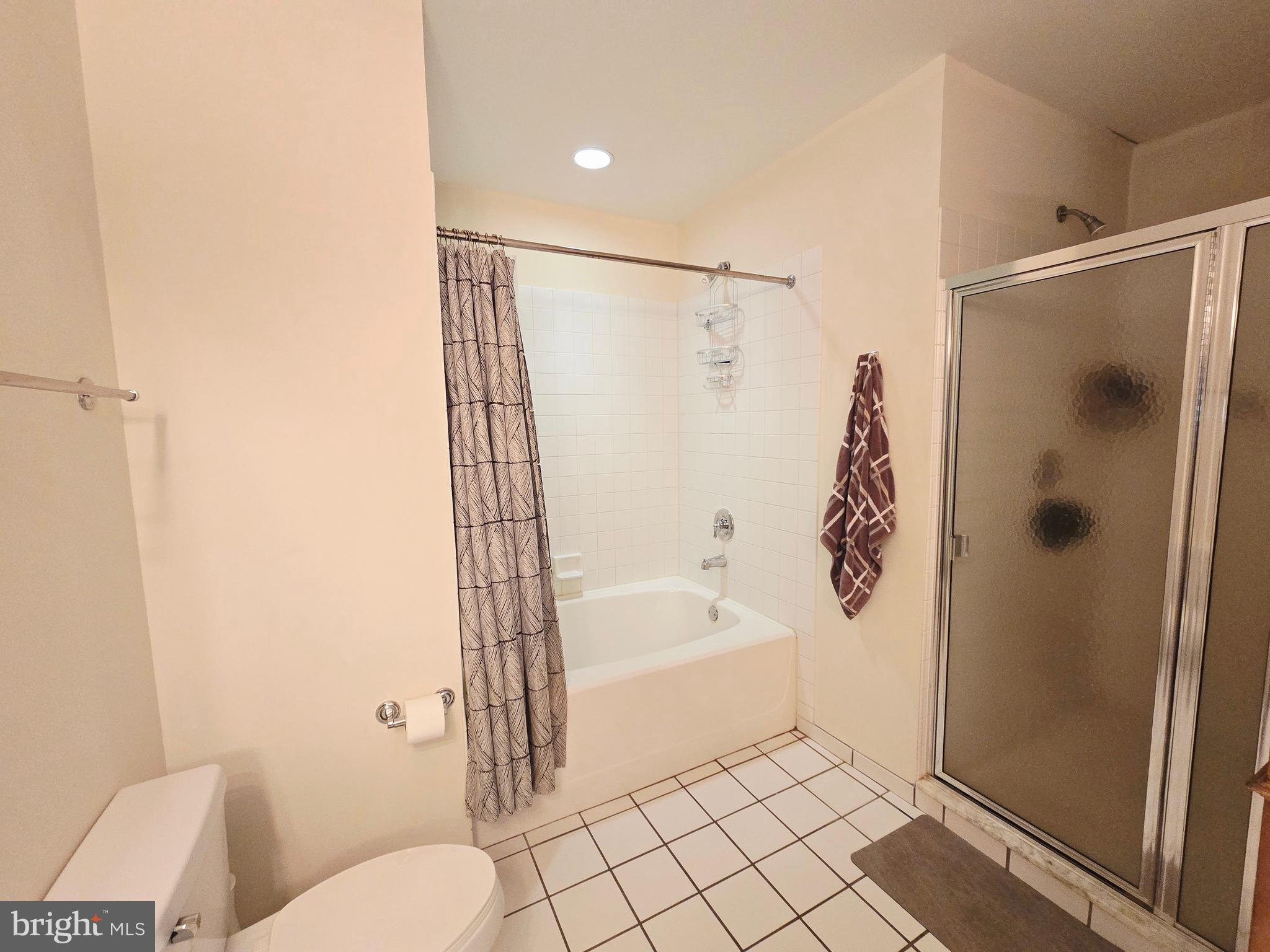 1600 Arch Street, Unit 1905 Philadelphia, PA 19103 - Photo 56 of 92 a bathroom with a bathtub and a shower