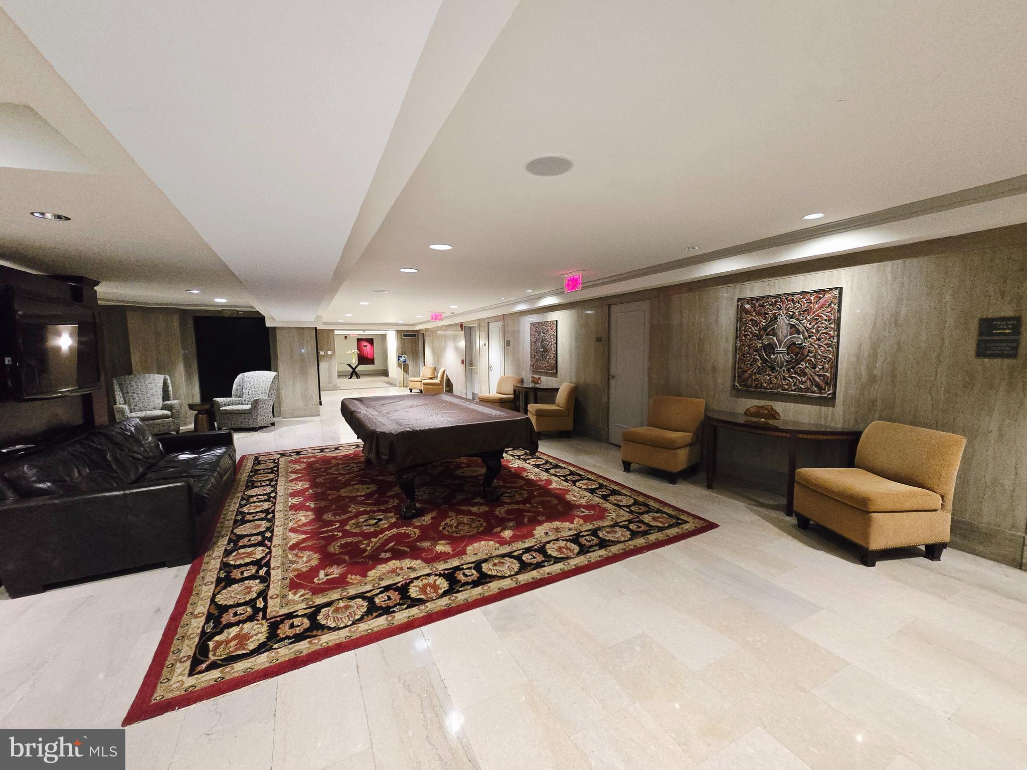 1600 Arch Street, Unit 1905 Philadelphia, PA 19103 - Photo 58 of 92 a living room with furniture and a rug