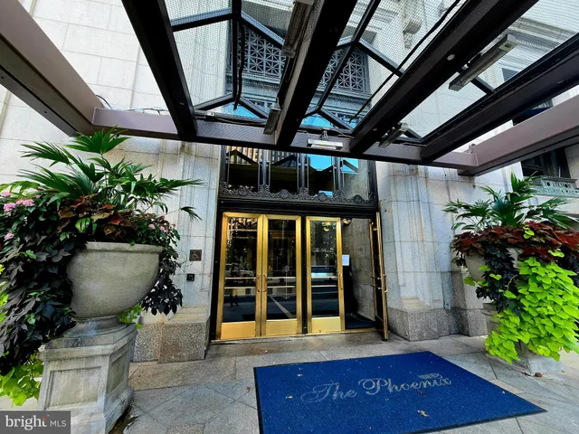 a lobby with a table and chairs