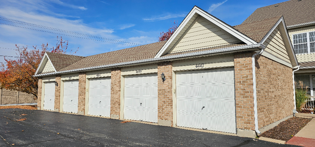 4449 Timber Ridge Court, Unit 105D Joliet, IL 60431 - Photo 3 of 4 an outdoor view of house