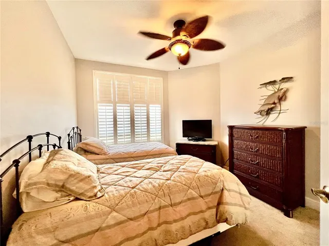 a bathroom with a sink vanity mirror and toilet