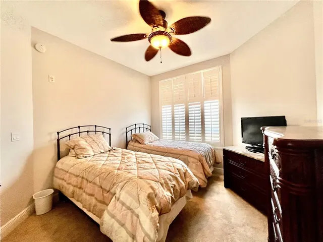 a bed room with a bed and a chandelier