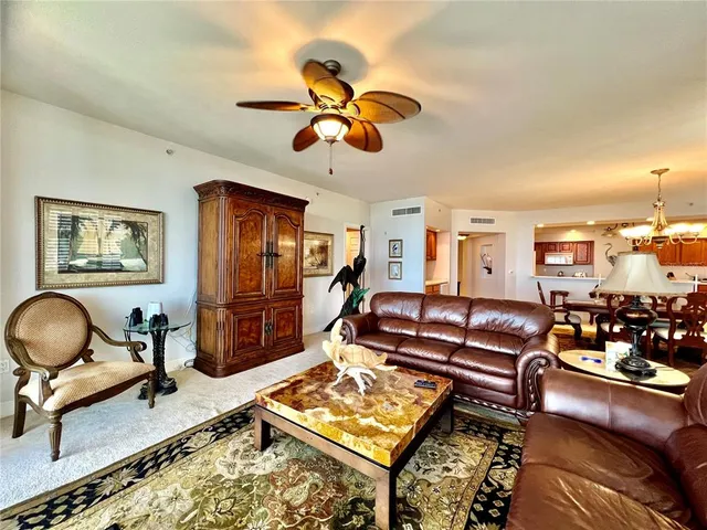 a large white kitchen with cabinets a sink and a stove