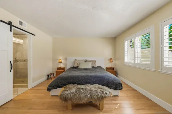a bathroom with a shower a toilet and a sink