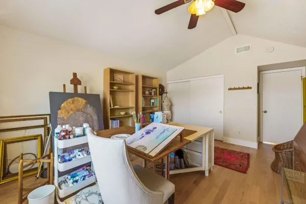 a roof deck with table and chairs a barbeque and potted plants