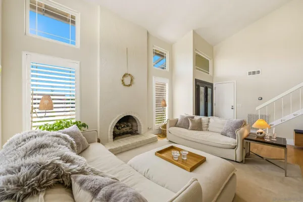 a kitchen with granite countertop stainless steel appliances cabinets a sink and a window