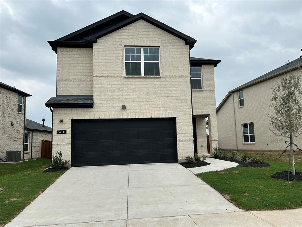 3201 Cordelia Drive Princeton, TX 75407 - Photo 1 of 20 View of front of house featuring brick siding, driveway, a front lawn, and an attached garage