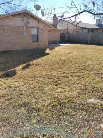 a view of yard with an outdoor space