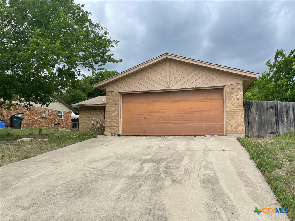 213 Blanket Drive Copperas Cove, TX 76522 - Photo 2 of 14 a front view of house with yard and trees