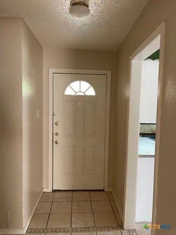 a kitchen with stainless steel appliances a refrigerator and a stove top oven