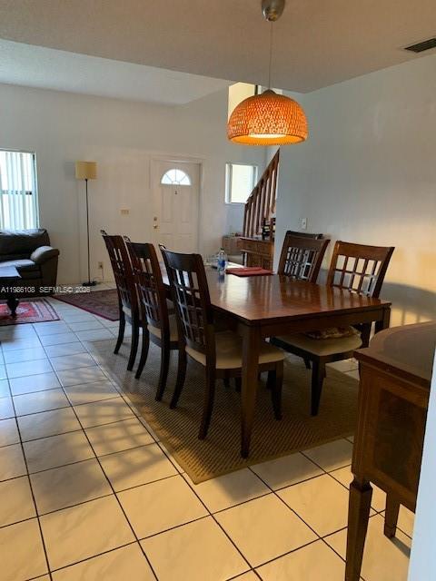 513 Racquet Club Road, Unit 55 Weston, FL 33326 - Photo 5 of 25 a view of a dining room with furniture and chandelier